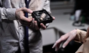 A warped gift box with curled edges, demonstrating the negative effects of poor humidity control in box production.